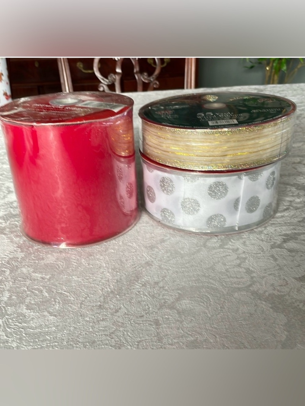 Lot of three rolls of premium holiday decor ribbon.